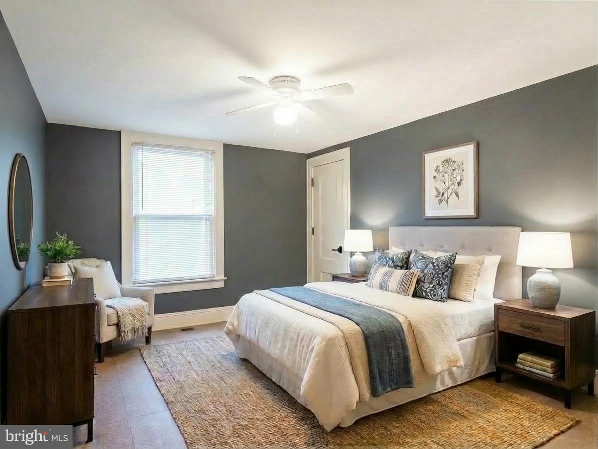 108 Fitzrandolph Avenue Hamilton, NJ 08610 - Photo 19 of 30 a bedroom with a bed and a chandelier