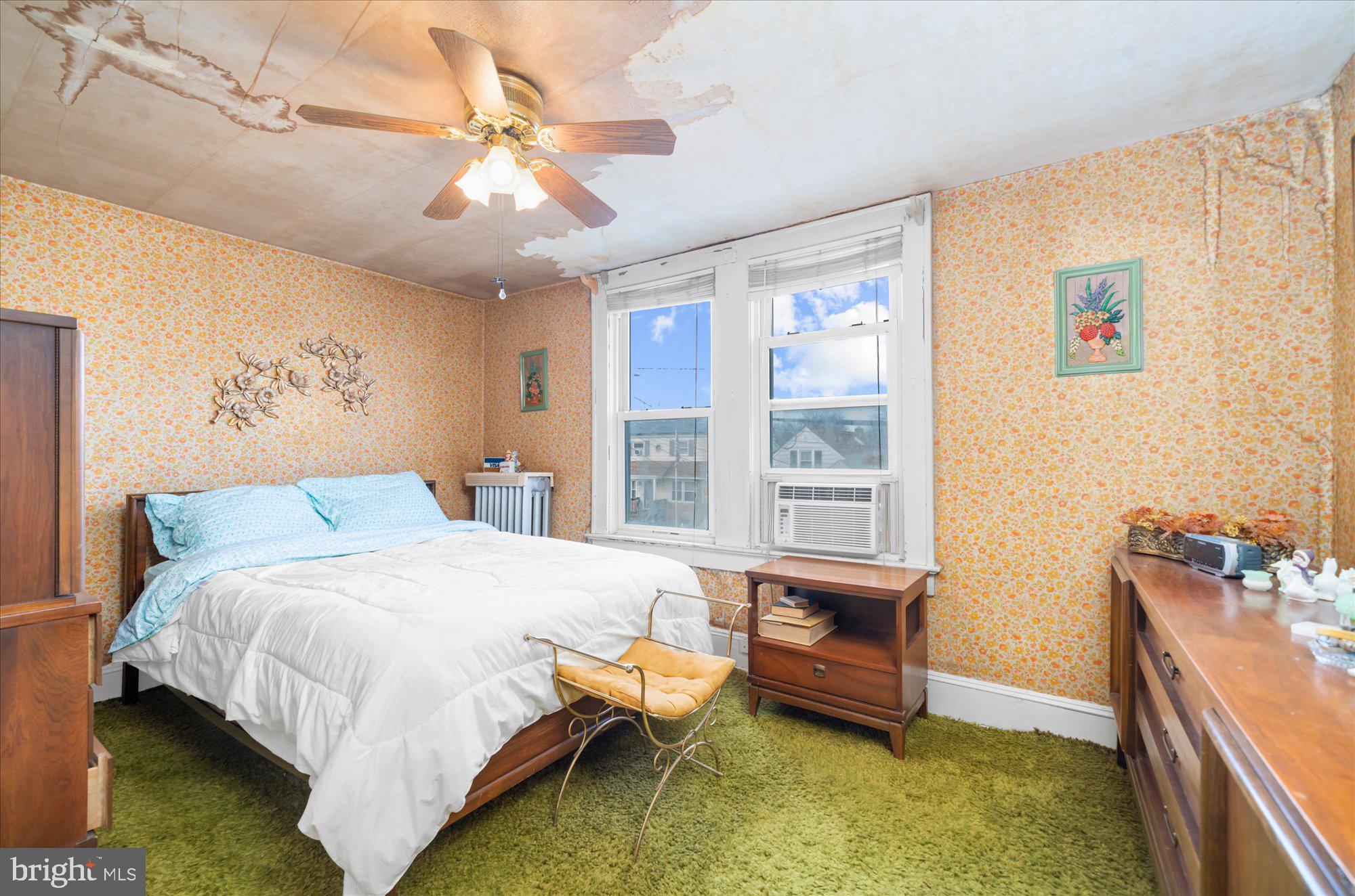 108 Fitzrandolph Avenue Hamilton, NJ 08610 - Photo 20 of 30 a bedroom with a bed and a chandelier