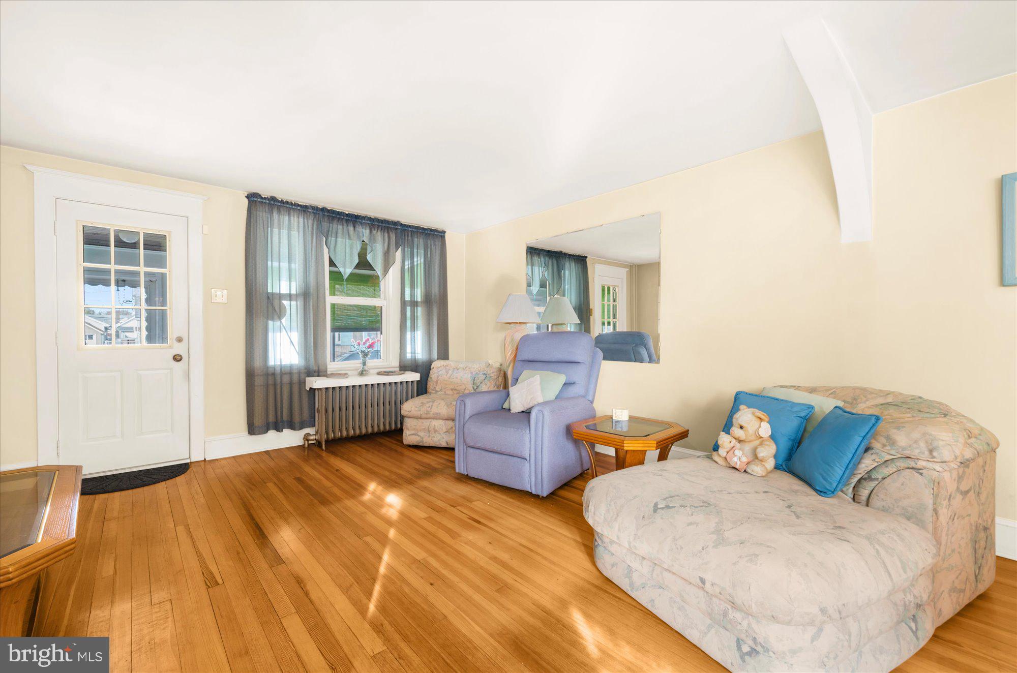 108 Fitzrandolph Avenue Hamilton, NJ 08610 - Photo 6 of 30 a bedroom with a bed and wooden floor