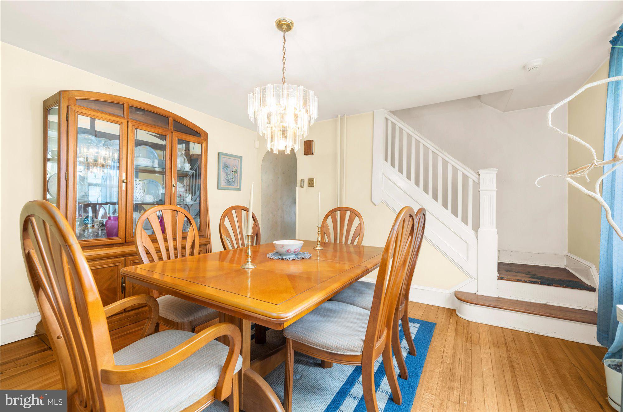 108 Fitzrandolph Avenue Hamilton, NJ 08610 - Photo 8 of 30 a view of a dining room with furniture a chandelier and wooden floor