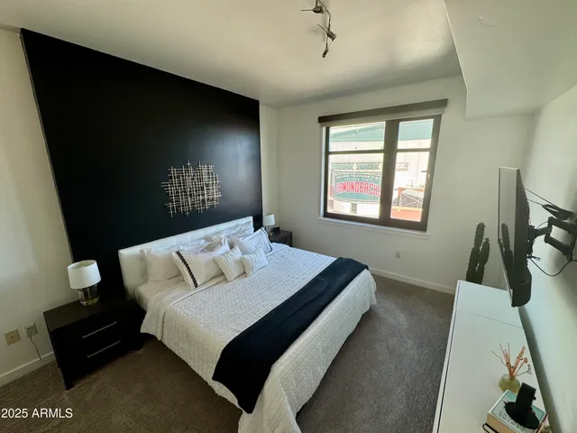 a bathroom with a tub sink and shower