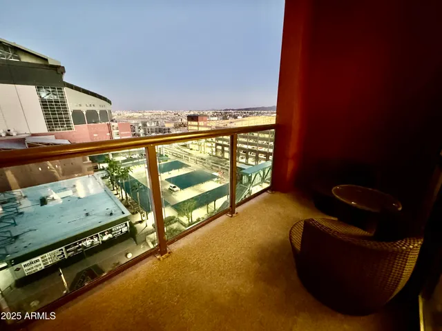 a view of a building with an outdoor seating