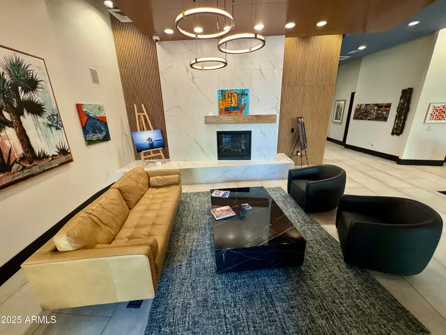 a view of a house with swimming pool and sitting area