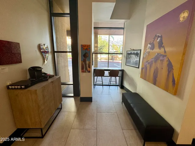 a view of a chairs and table in a patio