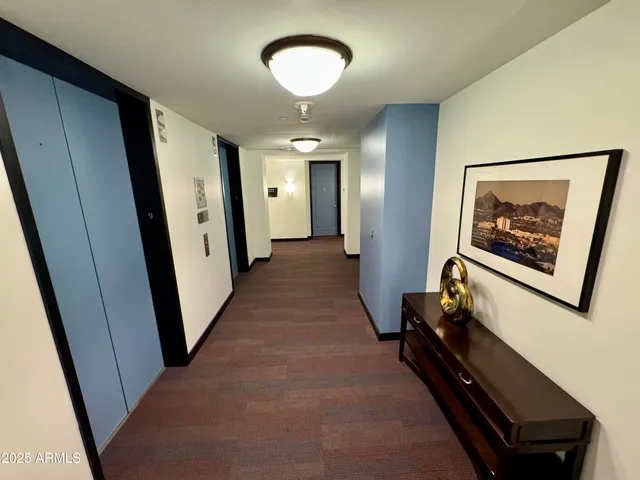 a view of a roof deck with couches and city view