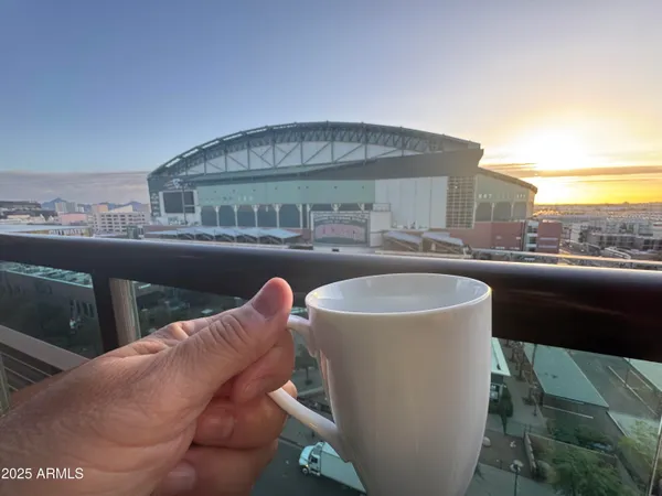 a view of a balcony with table and chairs