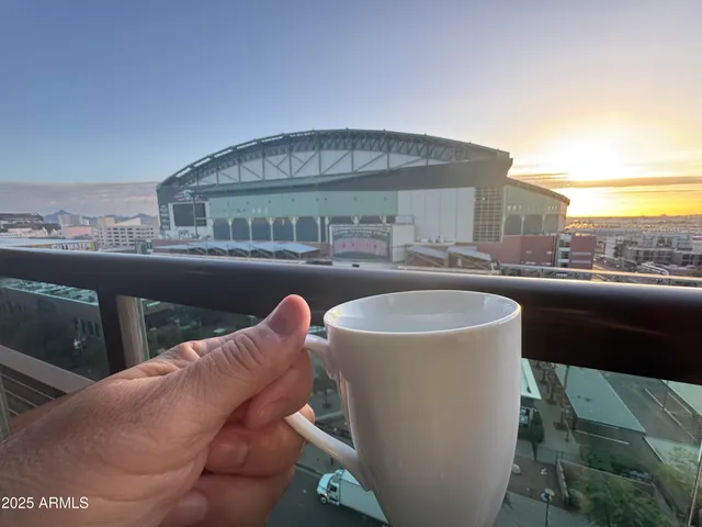 a view of a balcony with table and chairs