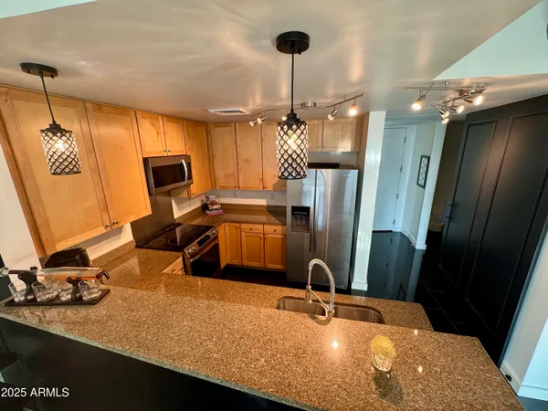a bathroom with a sink a mirror and shower