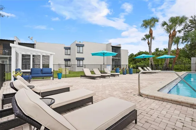 a view of a patio with swimming pool