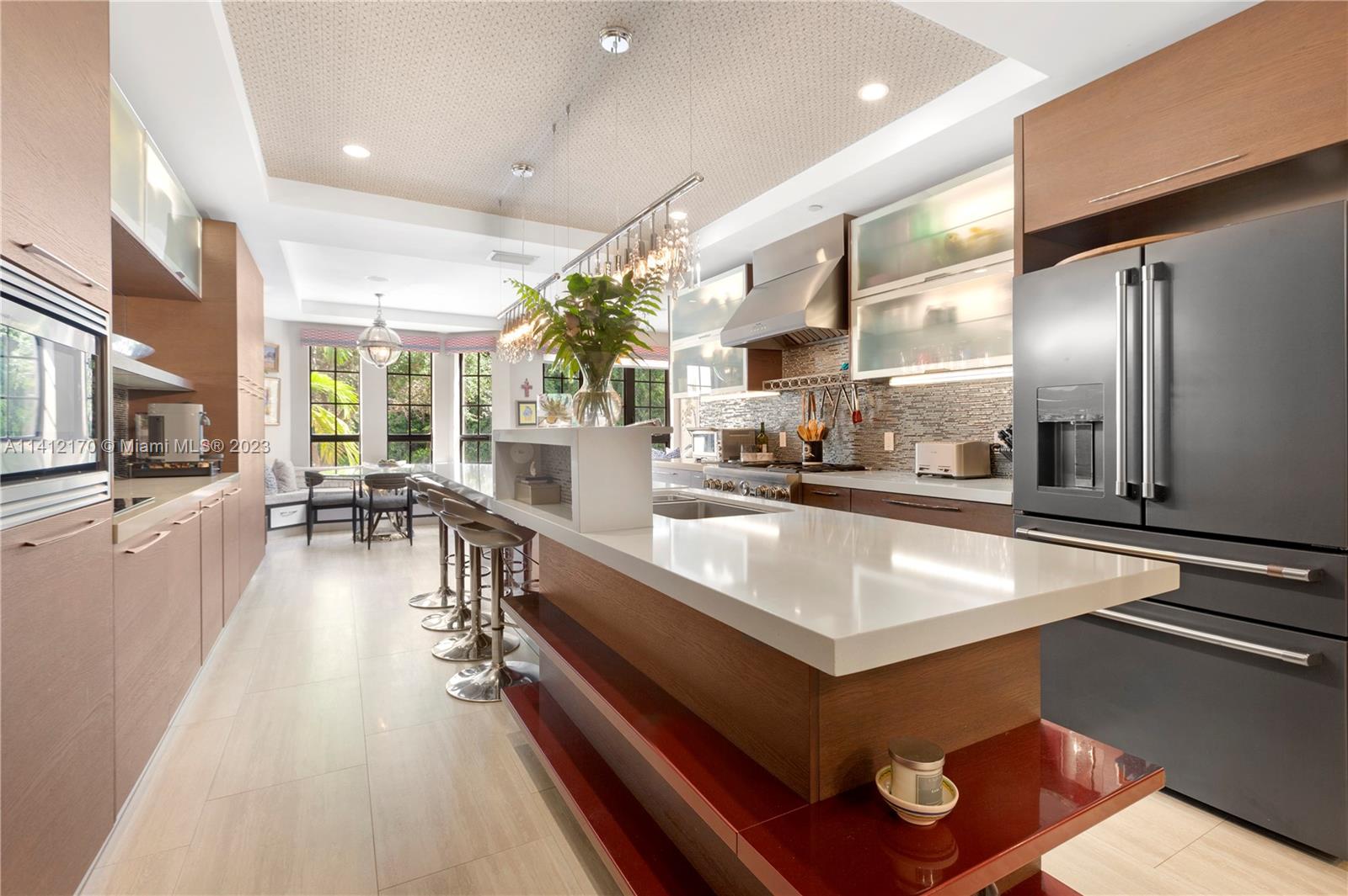 a kitchen with counter top space a sink and stainless steel appliances