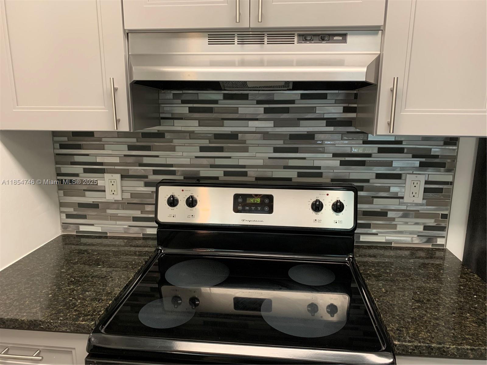 Royal Poinciana Condominium Pompano Beach, FL 33069 - Photo 2 of 6 a stove top oven sitting inside of a kitchen