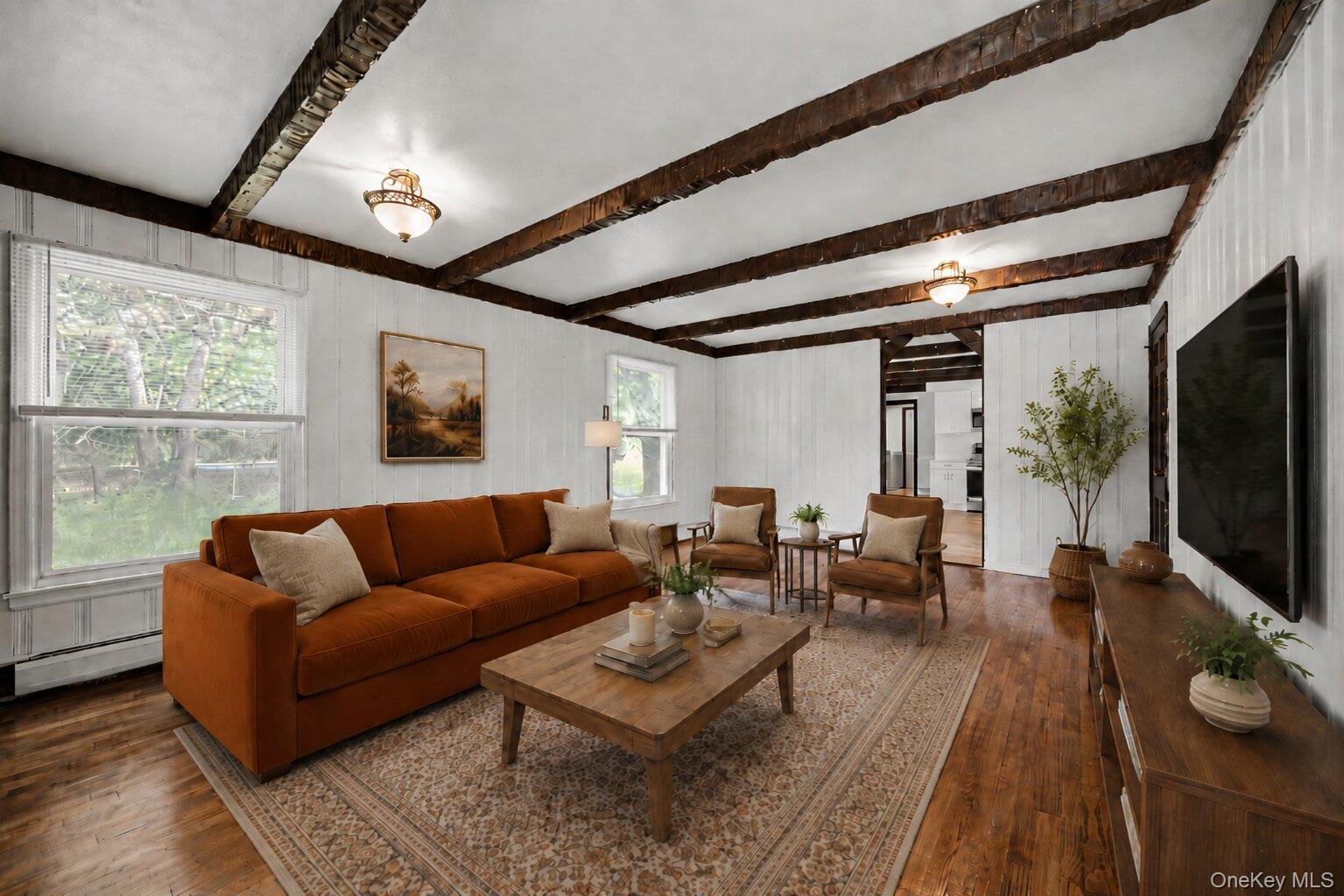 25 Hill Road Middletown, NY 10941 - Photo 6 of 47 Virtually Staged. Spacious family room offering additional living space with a cozy feel, ideal for relaxing, movie nights, or gathering with guests.