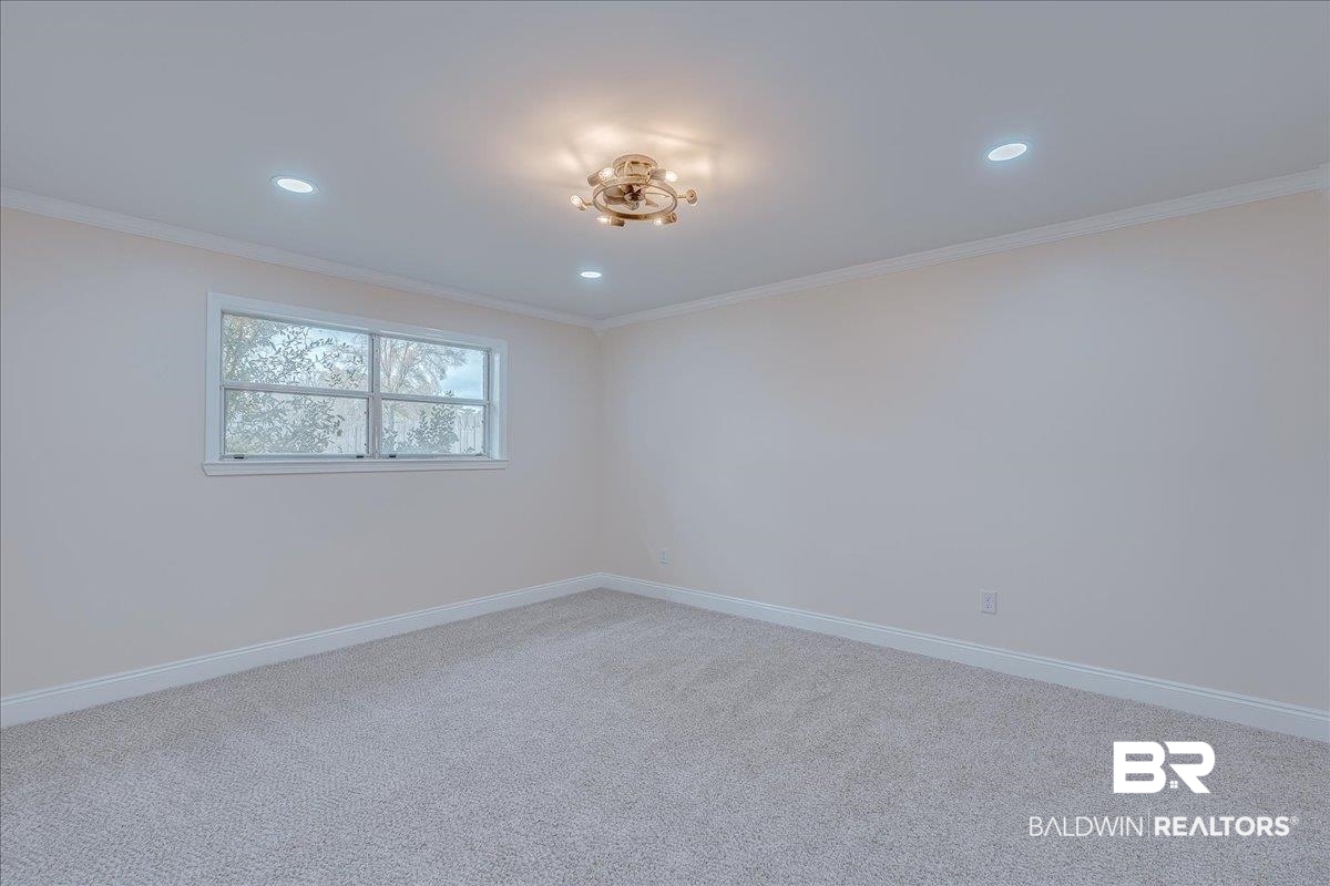 440 Dykes Road Mobile, AL 36608 - Photo 23 of 49 Unfurnished room with carpet flooring, recessed lighting, baseboards, and ornamental molding