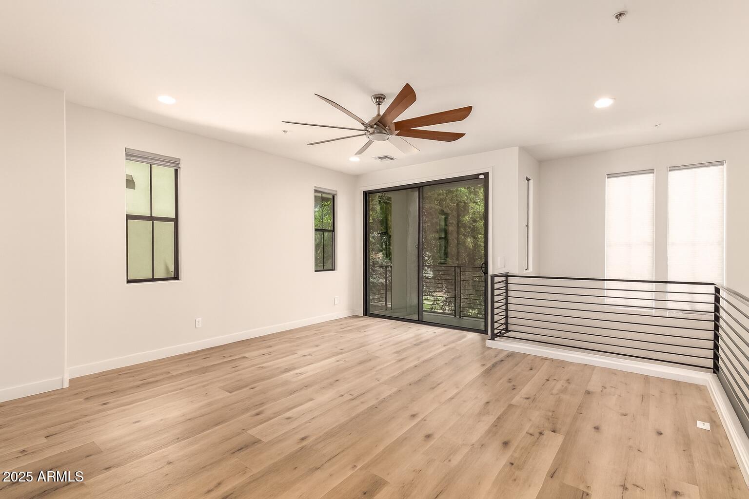 4235 North 26th Street, Unit 5 Phoenix, AZ 85016 - Photo 9 of 41 a view of a livingroom with a window and a ceiling fan