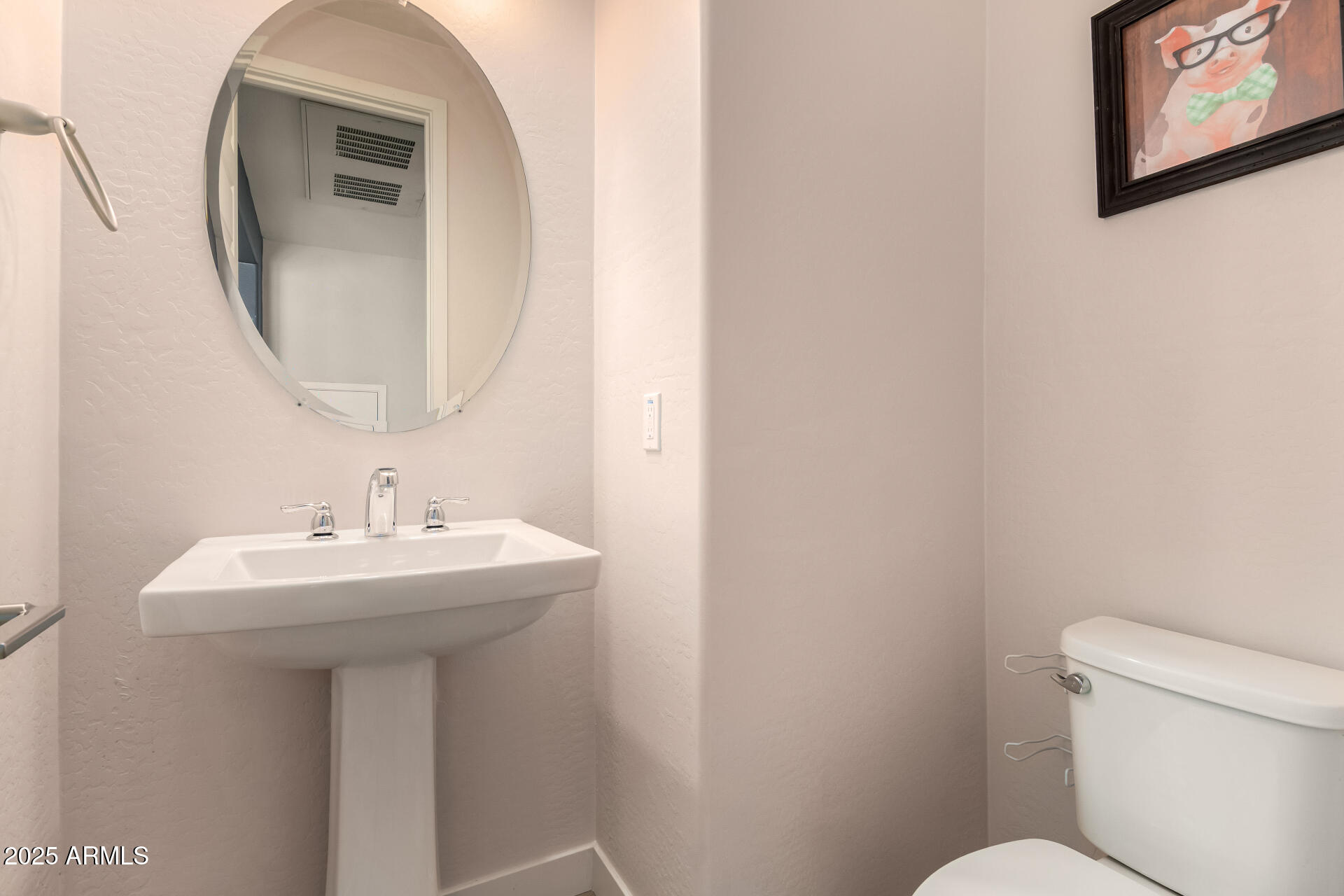 4235 North 26th Street, Unit 5 Phoenix, AZ 85016 - Photo 11 of 41 a bathroom with a toilet sink and mirror