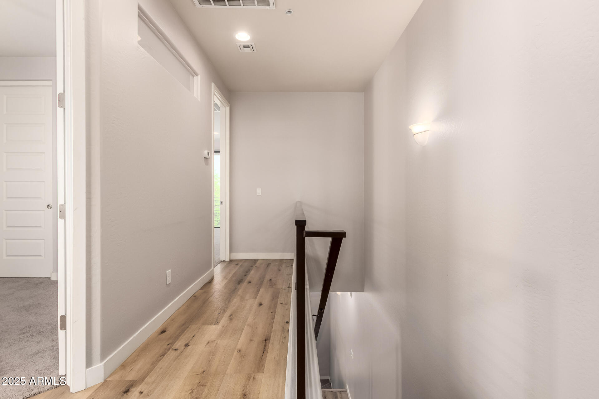 4235 North 26th Street, Unit 5 Phoenix, AZ 85016 - Photo 21 of 41 a view of a hallway with wooden floor and stairs