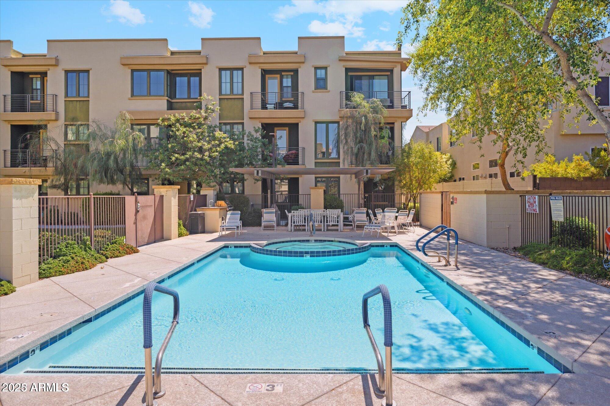4235 North 26th Street, Unit 5 Phoenix, AZ 85016 - Photo 29 of 41 a swimming pool with outdoor seating and yard