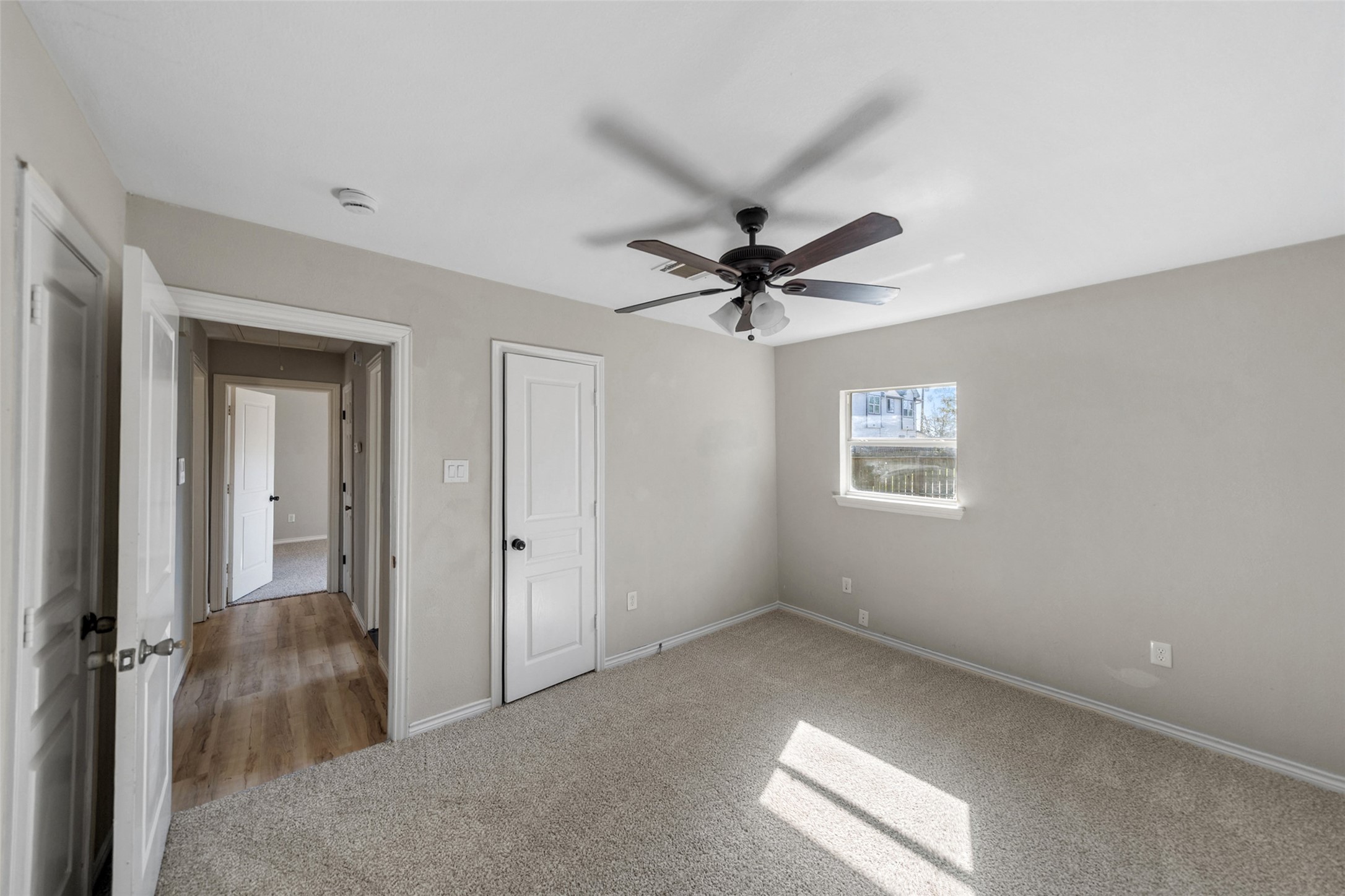 7019 Sur Court Houston, TX 77033 - Photo 14 of 22 a view of a big room with a chandelier fan and windows