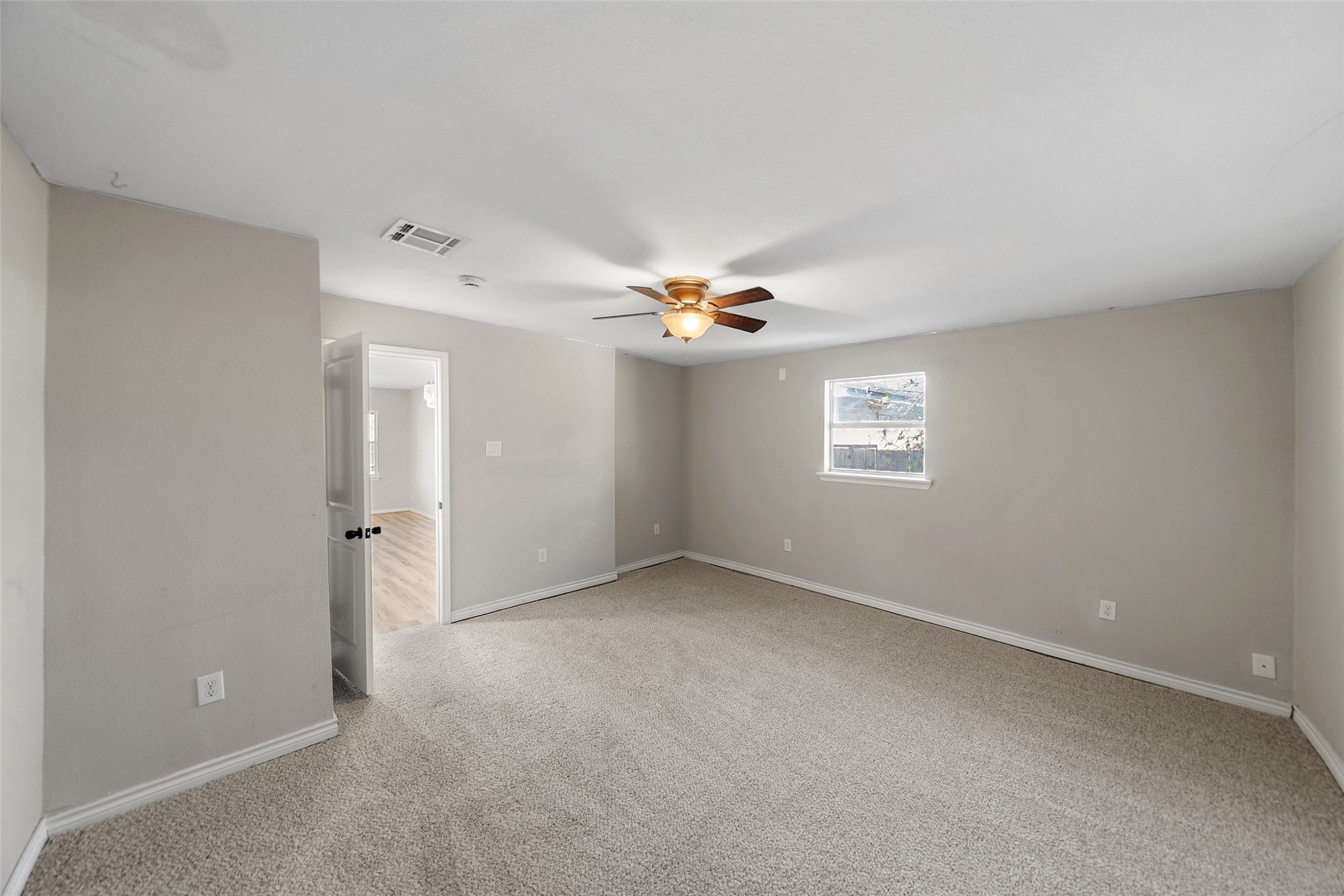 7019 Sur Court Houston, TX 77033 - Photo 16 of 22 an empty room with a ceiling fan and window