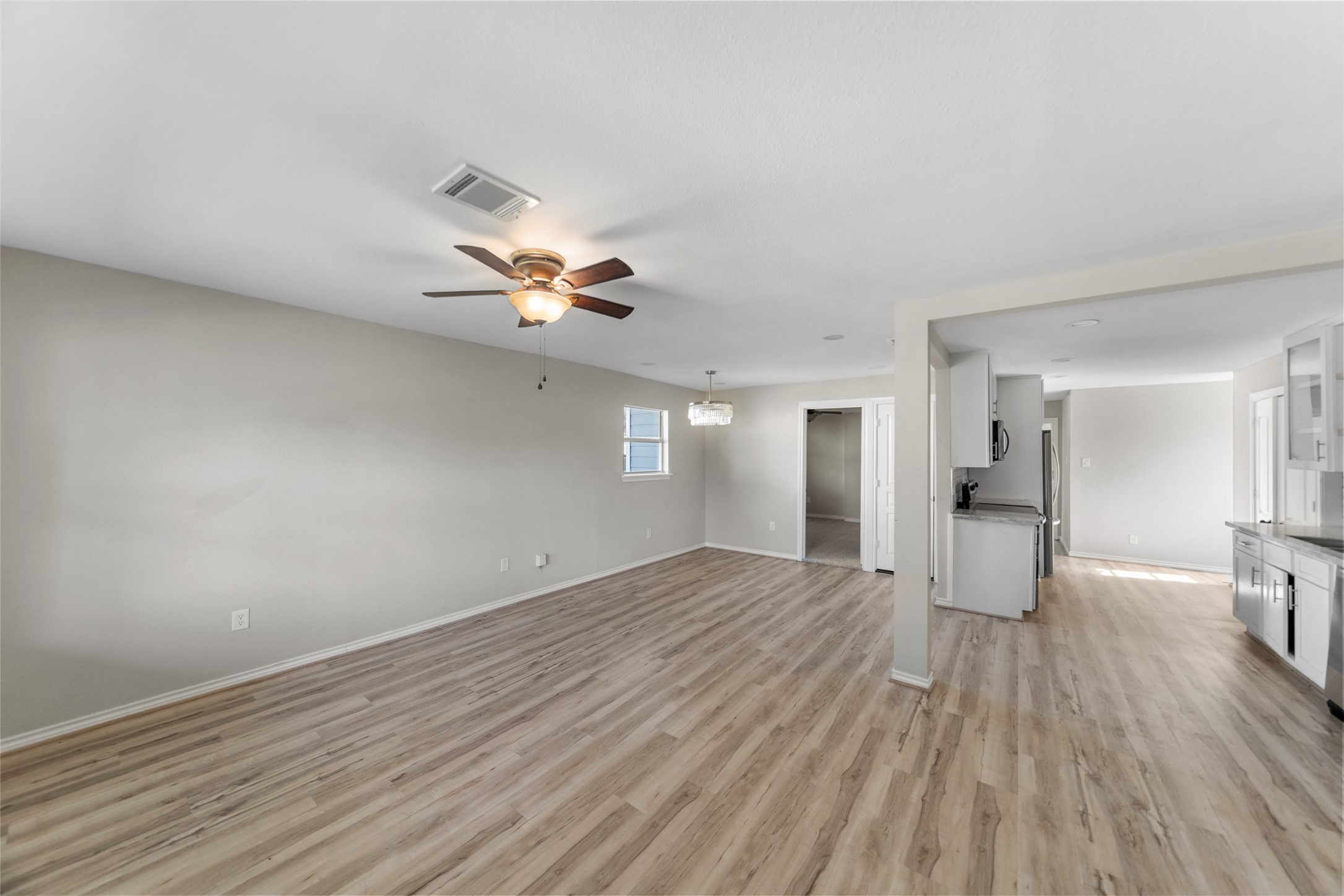 7019 Sur Court Houston, TX 77033 - Photo 9 of 22 a view of empty room with wooden floor