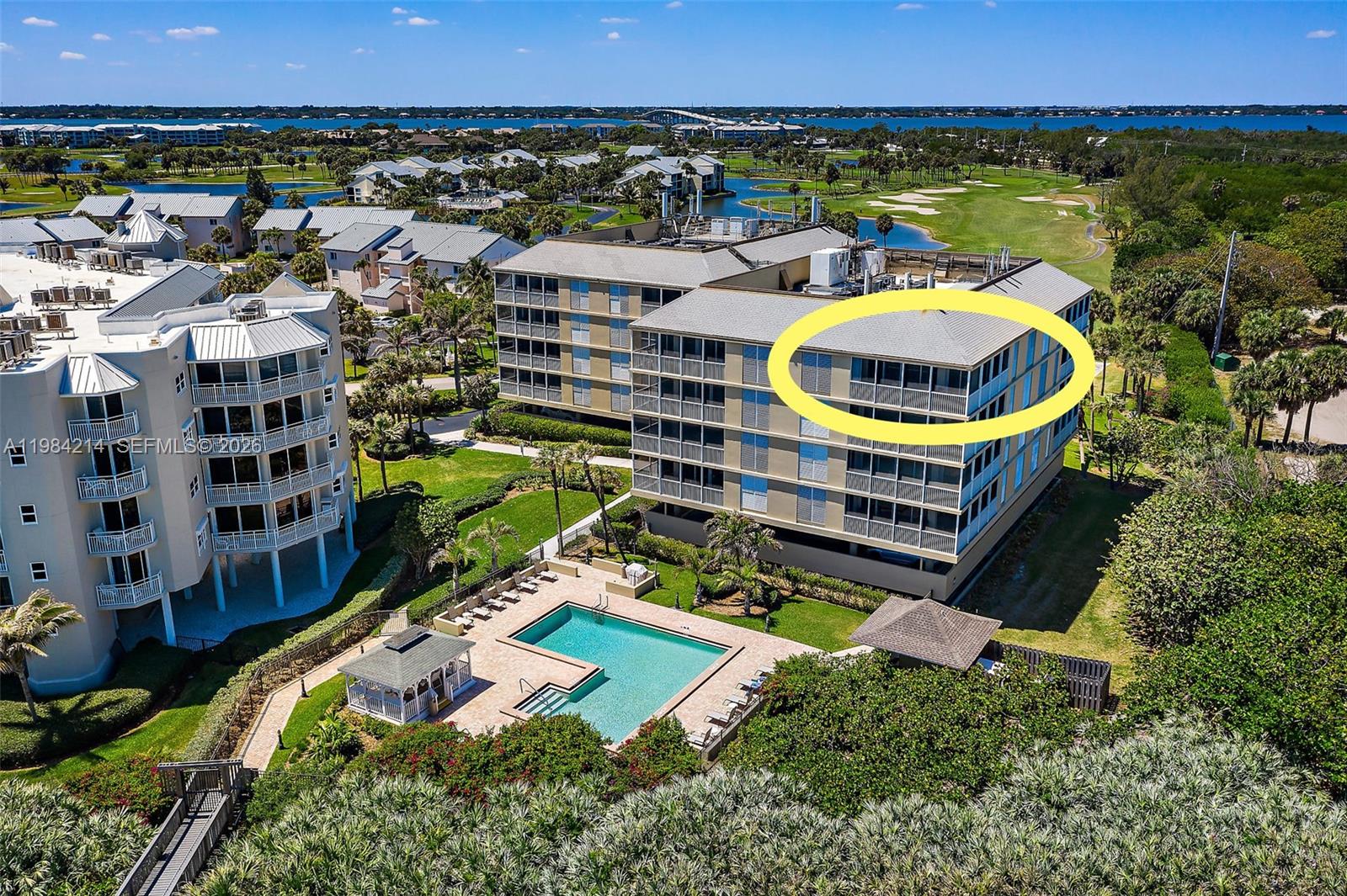 669 Northeast Plantation Road, Unit 406 Stuart, FL 34996 - Photo 5 of 41 an aerial view of residential houses with outdoor space and swimming pool