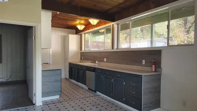 a spacious bathroom with a sink and a large mirror