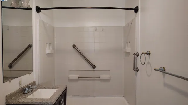 a bathroom with a sink and a mirror