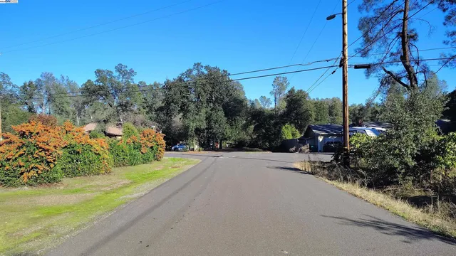 a view of a road with a building in the background