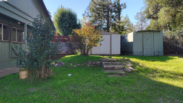 a view of a back yard of the house