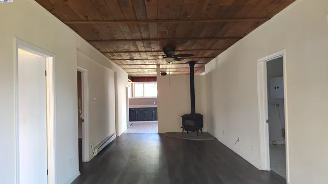 a view of hallway with wooden floor