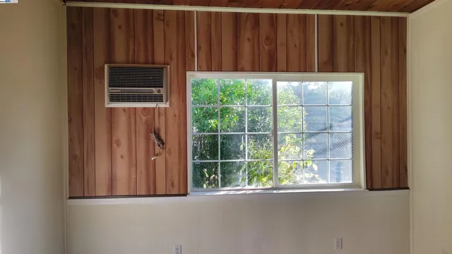 a view of a door and wooden floor