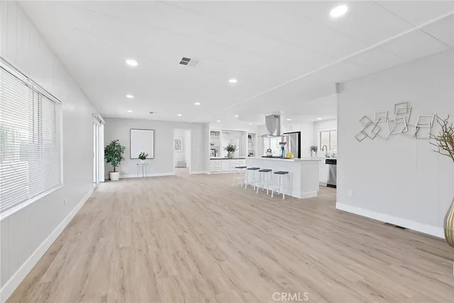 a view of kitchen with wooden floor and windows