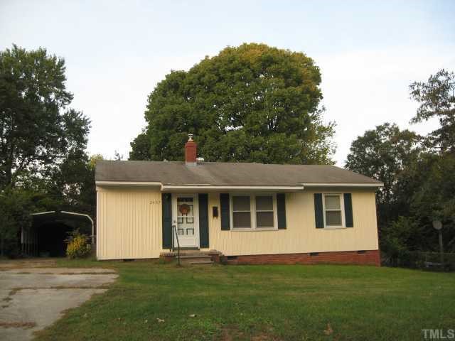 2407 Glascock Street Raleigh, NC 27610 - Photo 1 of 7 a front view of a house with a garden