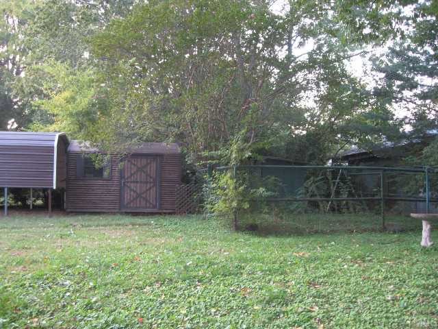 2407 Glascock Street Raleigh, NC 27610 - Photo 5 of 7 a backyard of a house with lots of green space