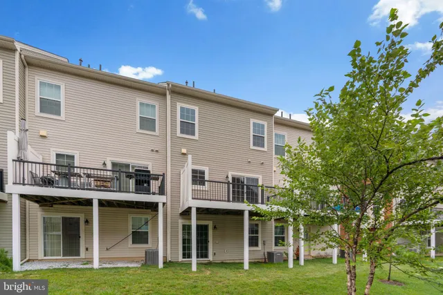 a view of an apartment with a garden