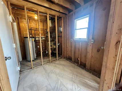 a view of a porch with wooden floor and fence