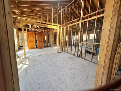 a view of an chairs and table on the wall