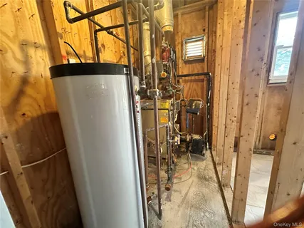 a view of an empty room with wooden walls