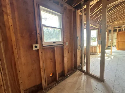 a view of an empty room with windows