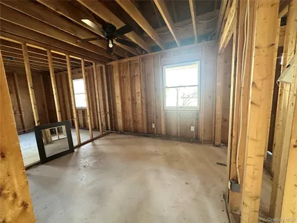 a view of an empty room with windows