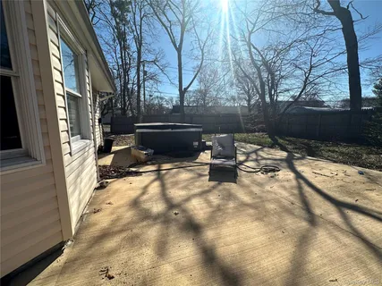 a view of a backyard with sitting area