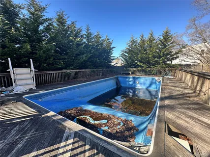 a view of a house with wooden fence