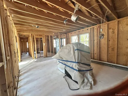 a living room with a table and chairs