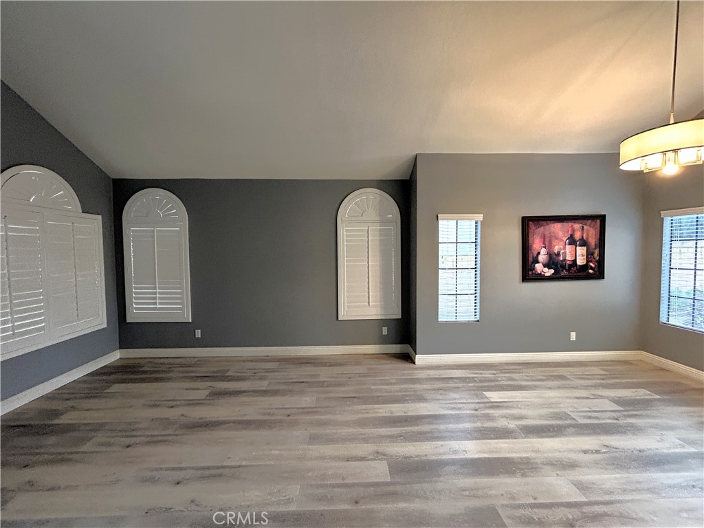 3773 Burning Tree Drive Ontario, CA 91761 - Photo 11 of 28 a view of a livingroom with wooden floor and a window