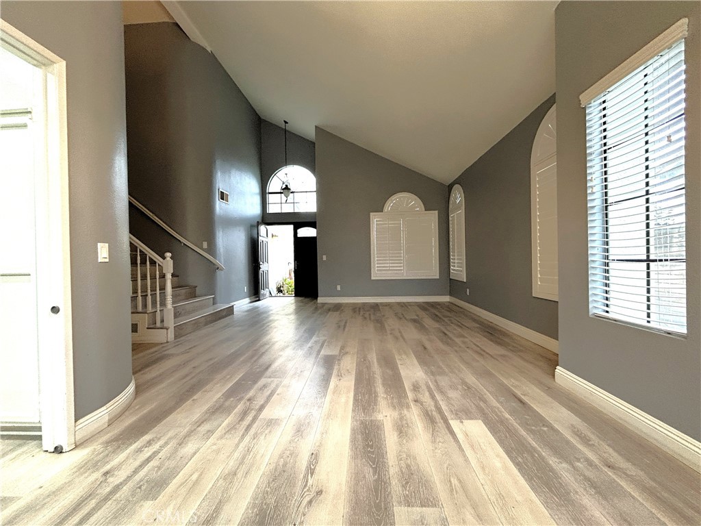 3773 Burning Tree Drive Ontario, CA 91761 - Photo 12 of 28 a view of empty room with wooden floor