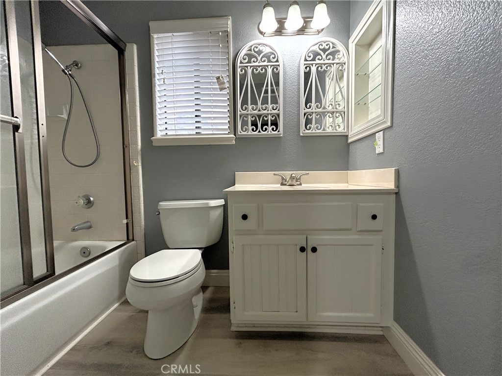 3773 Burning Tree Drive Ontario, CA 91761 - Photo 17 of 28 a bathroom with a toilet sink and mirror
