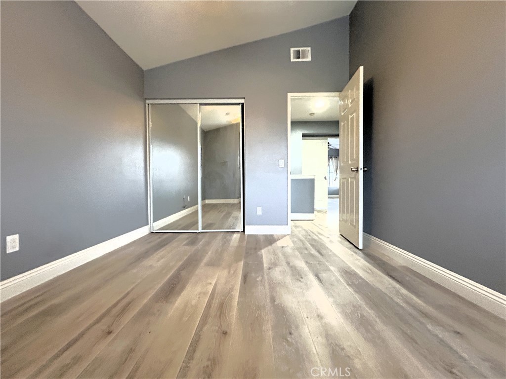 3773 Burning Tree Drive Ontario, CA 91761 - Photo 19 of 28 a view of empty room with wooden floor