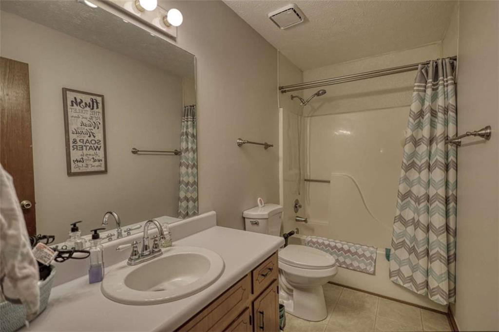 2740 Dennard Road Northeast Conyers, GA 30013 - Photo 31 of 51 a bathroom with a sink toilet and shower