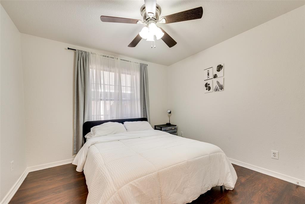 106 Villanova Circle Forney, TX 75126 - Photo 19 of 26 a bedroom with a bed and a window