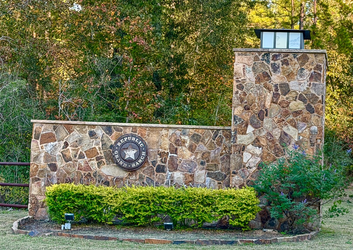 10662 Ruger Road Willis, TX 77378 - Photo 9 of 15 front view of a brick wall with a bench